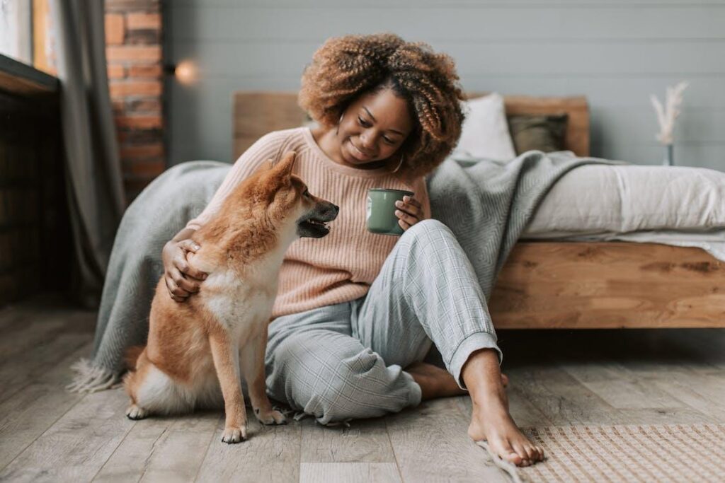 A woman caring for her fearful dog